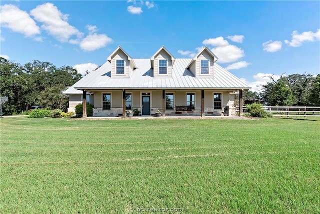 rear view of property with a porch and a yard