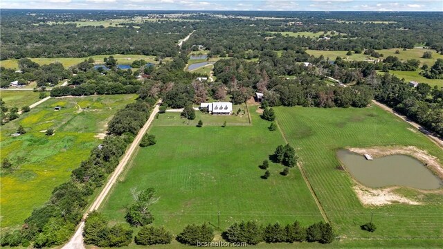 bird's eye view with a rural view and a water view