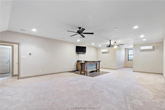 basement with ceiling fan, an AC wall unit, and light carpet