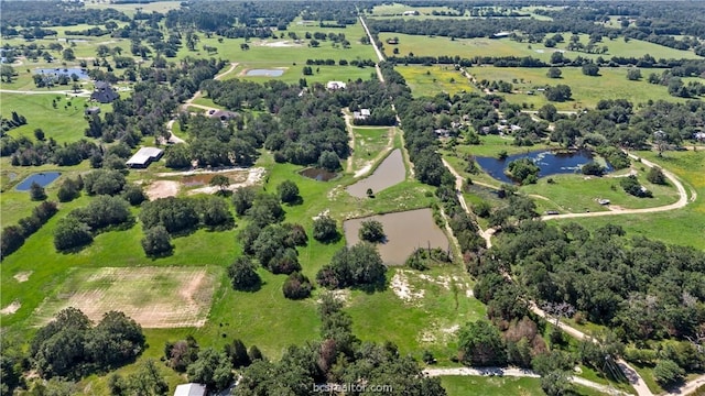 bird's eye view with a water view and a rural view