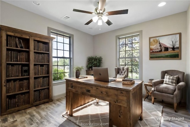 office featuring ceiling fan and light wood-type flooring