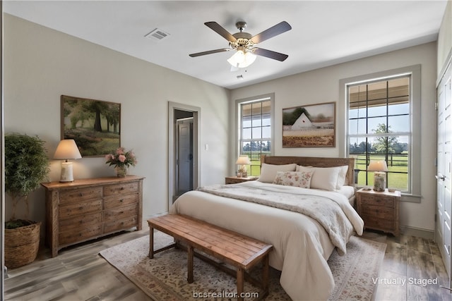 bedroom with hardwood / wood-style flooring and ceiling fan