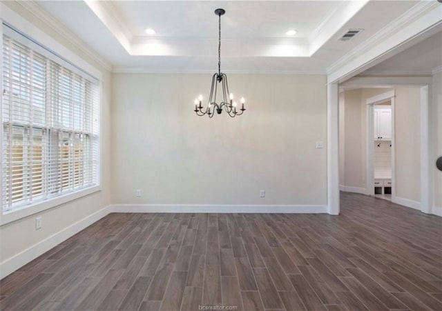 unfurnished room with a notable chandelier, visible vents, dark wood-type flooring, and a raised ceiling