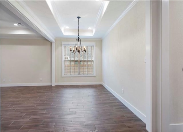 unfurnished dining area with baseboards, dark wood-style flooring, a tray ceiling, and an inviting chandelier