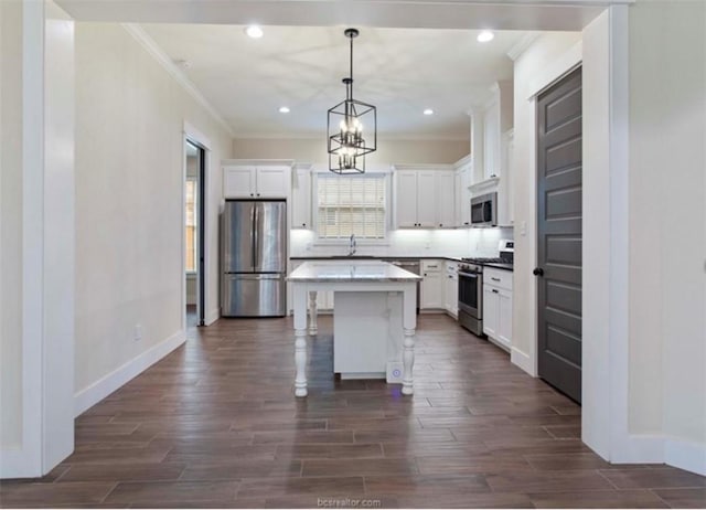 kitchen featuring a wealth of natural light, white cabinetry, and stainless steel appliances