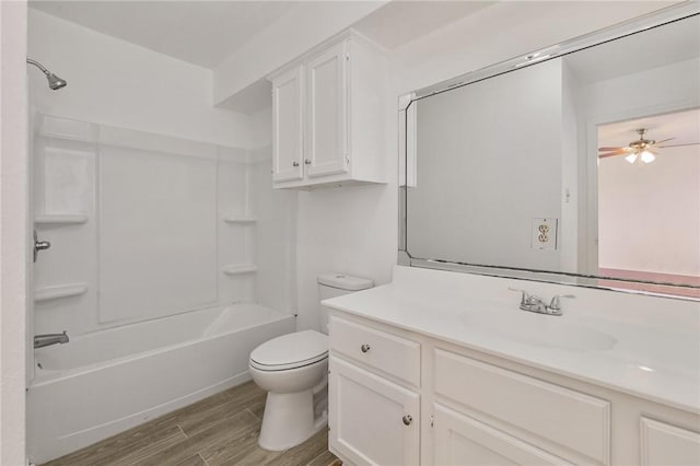 full bathroom featuring toilet, shower / bathtub combination, vanity, and wood finish floors