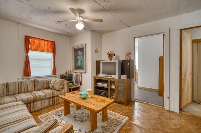 living area with ceiling fan