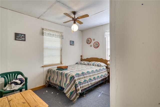 bedroom with carpet flooring, baseboards, and ceiling fan