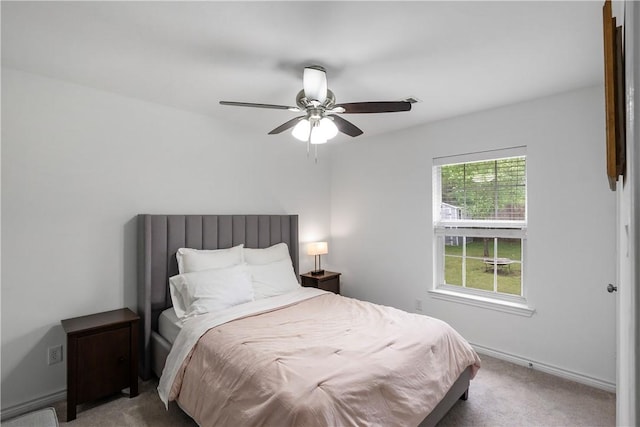 bedroom featuring baseboards, a ceiling fan, and carpet floors