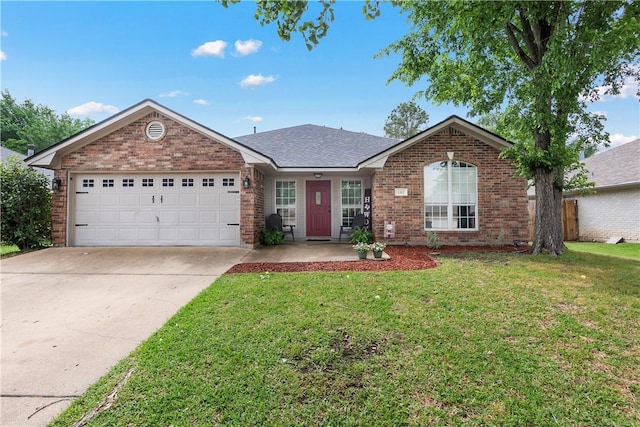 ranch-style home with brick siding, a front lawn, driveway, and an attached garage