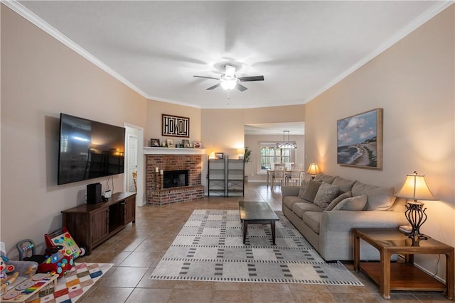 tiled living room with a fireplace, a ceiling fan, and crown molding