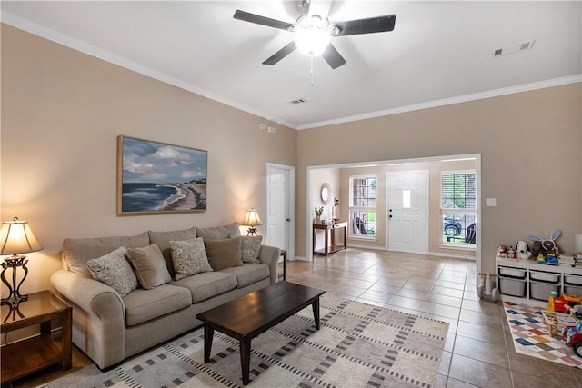 tiled living room featuring crown molding, a ceiling fan, visible vents, and baseboards