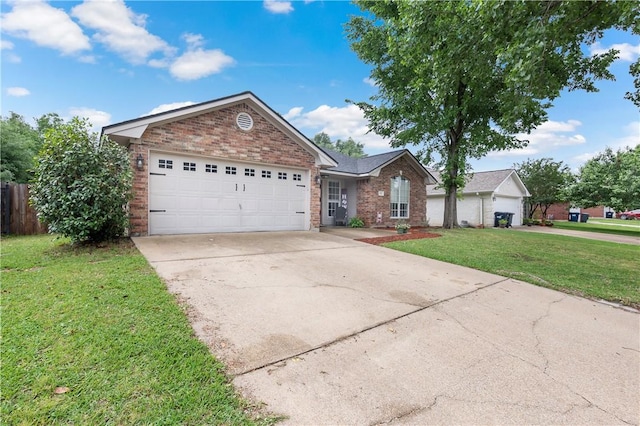 single story home with a garage, brick siding, a front yard, and driveway
