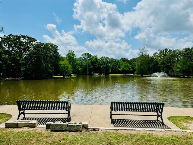 surrounding community with a water view