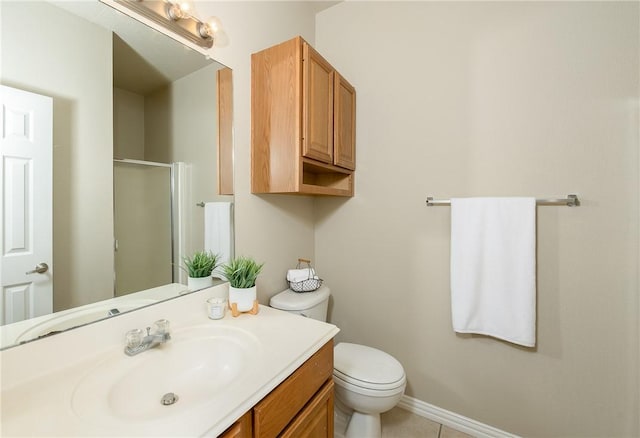 full bathroom featuring a shower with door, vanity, baseboards, toilet, and tile patterned flooring