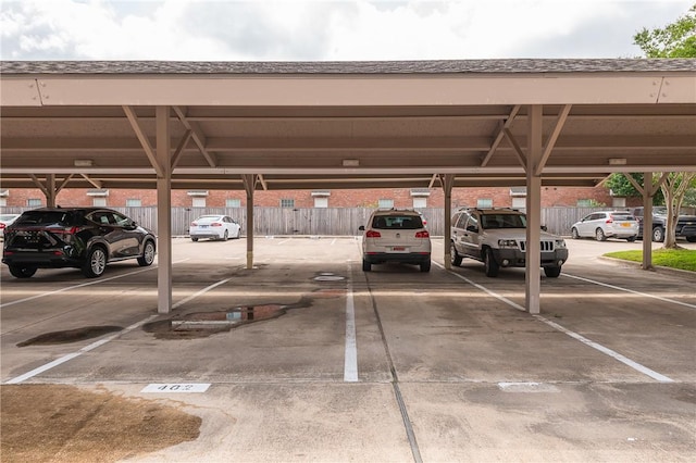 covered parking lot with fence