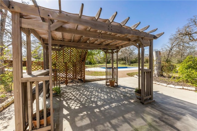 view of patio / terrace with an outdoor pool and a pergola