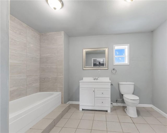 bathroom with tile patterned flooring, toilet, a bathtub, and baseboards