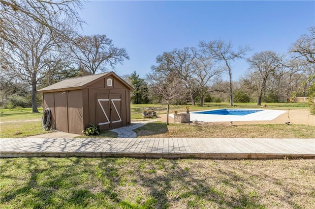 pool featuring an outbuilding, a lawn, and a storage shed