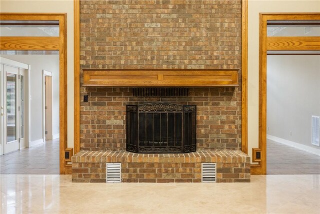 2629 Benton Dr, Brenham, TX 77833 - detailed view of baseboards and a brick fireplace