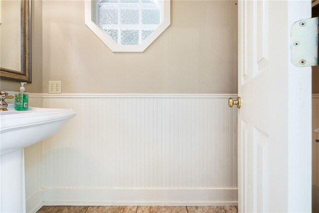 2629 Benton Dr, Brenham, TX 77833 - bathroom with wainscoting and a sink