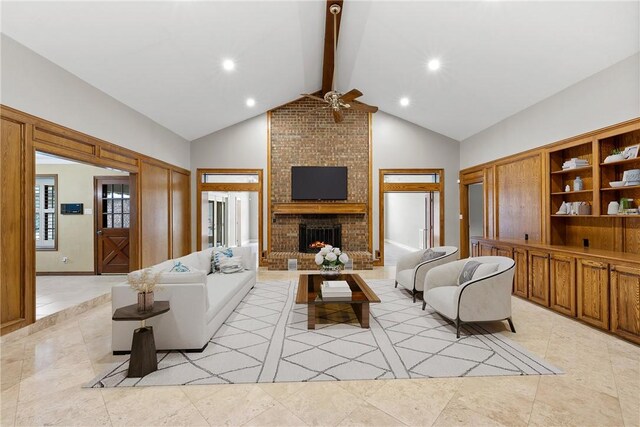 2629 Benton Dr, Brenham, TX 77833 - living area with a ceiling fan, beamed ceiling, a fireplace, high vaulted ceiling, and light tile patterned flooring