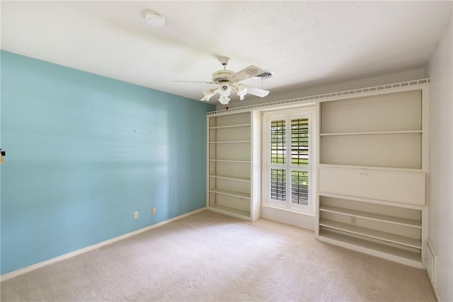 2629 Benton Dr, Brenham, TX 77833 - unfurnished bedroom featuring carpet flooring and ceiling fan