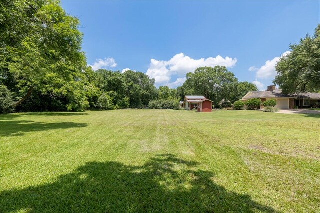 2629 Benton Dr, Brenham, TX 77833 - view of grassy yard featuring a shed