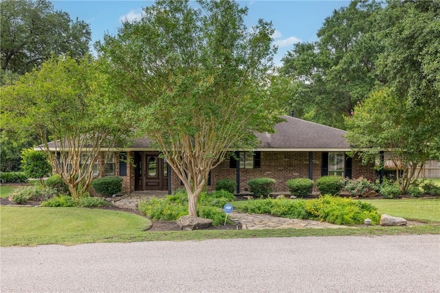 2629 Benton Dr, Brenham, TX 77833 - single story home with brick siding and a front yard