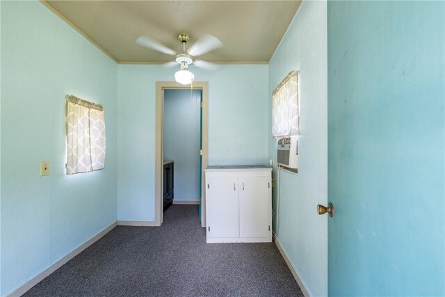 2629 Benton Dr, Brenham, TX 77833 - spare room featuring a ceiling fan, dark carpet, and cooling unit