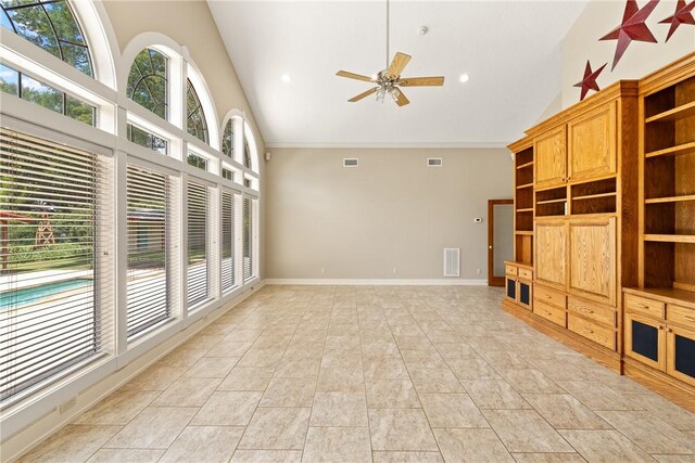 2629 Benton Dr, Brenham, TX 77833 - unfurnished living room with high vaulted ceiling, ceiling fan, light tile patterned floors, ornamental molding, and recessed lighting