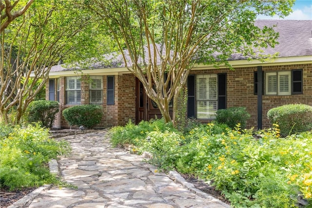 2629 Benton Dr, Brenham, TX 77833 - single story home featuring brick siding and roof with shingles