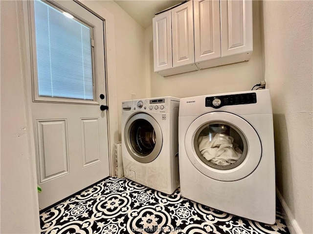 708 E 27th St E, Bryan, TX 77803 - laundry room featuring cabinets and separate washer and dryer