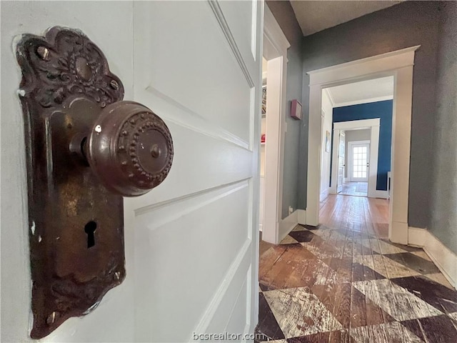 708 E 27th St E, Bryan, TX 77803 - hall with crown molding and dark wood-type flooring