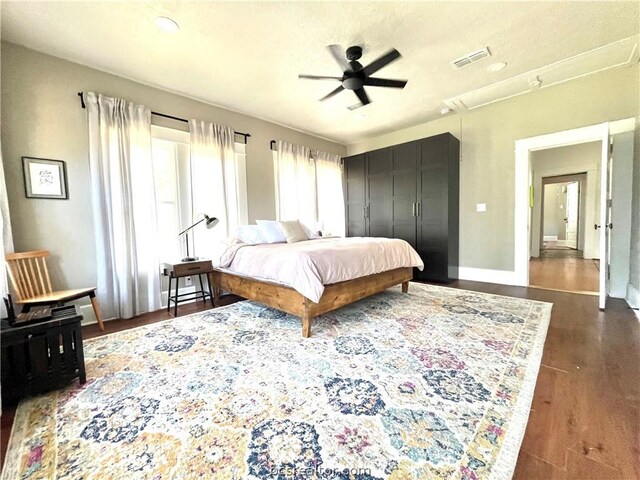 708 E 27th St E, Bryan, TX 77803 - bedroom featuring ceiling fan and dark wood-type flooring