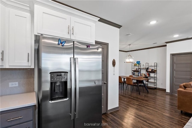 1000 Granite Ct, Bryan, TX 77803 - kitchen with stainless steel refrigerator with ice dispenser, ornamental molding, dark wood finished floors, white cabinetry, and baseboards