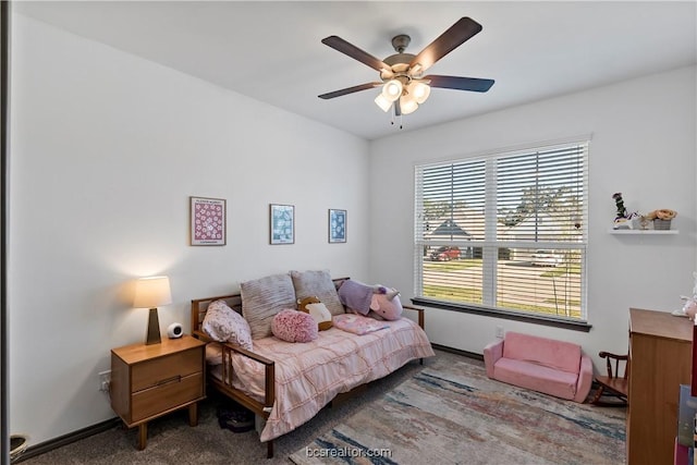 1000 Granite Ct, Bryan, TX 77803 - carpeted bedroom featuring baseboards and a ceiling fan