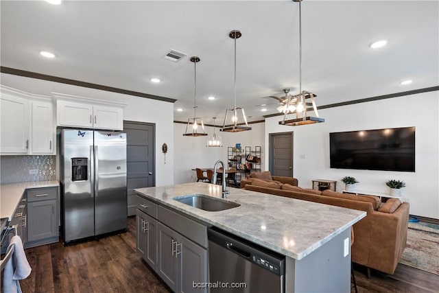 1000 Granite Ct, Bryan, TX 77803 - kitchen with appliances with stainless steel finishes, a sink, dark wood-type flooring, white cabinets, and recessed lighting