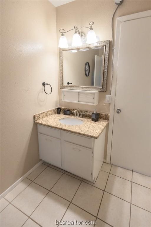 bathroom with tile patterned flooring and vanity