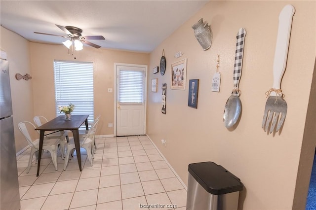 entryway with ceiling fan and light tile patterned floors