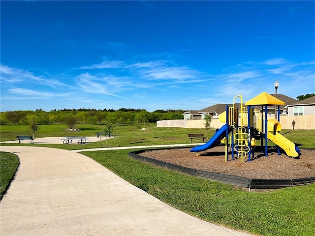 view of playground with a yard