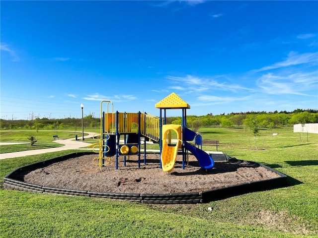 view of play area featuring a lawn