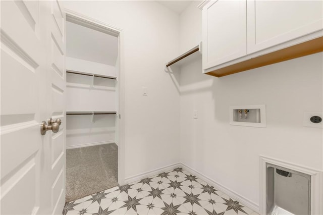 laundry area with cabinets, washer hookup, and hookup for an electric dryer