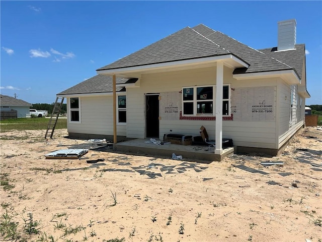 1937 Pinemont View Dr, Bryan, TX 77807 - rear view of property with a shingled roof and a chimney