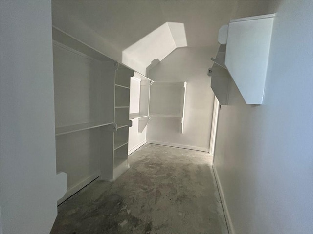 1937 Pinemont View Dr, Bryan, TX 77807 - spacious closet featuring vaulted ceiling