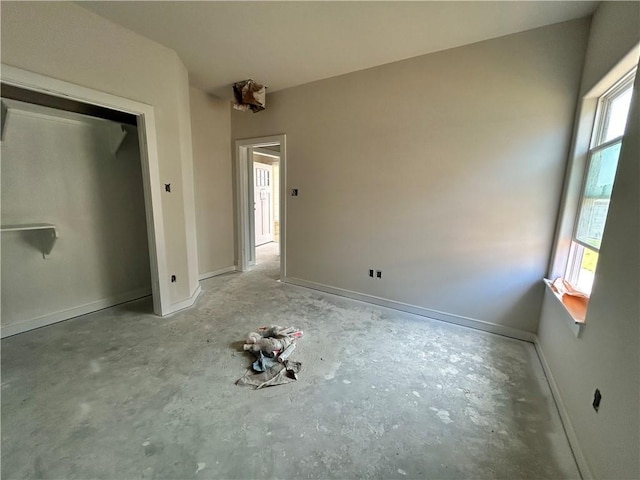 1937 Pinemont View Dr, Bryan, TX 77807 - unfurnished bedroom featuring multiple windows and unfinished concrete flooring