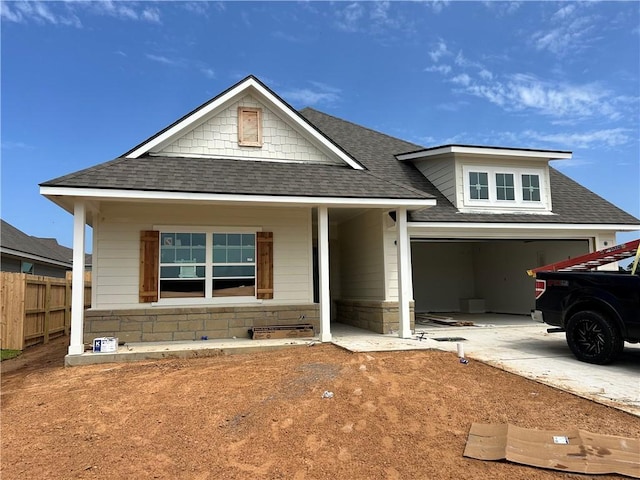 1937 Pinemont View Dr, Bryan, TX 77807 - view of front of home featuring a shingled roof, driveway, and a porch
