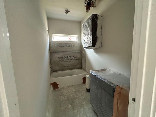 1937 Pinemont View Dr, Bryan, TX 77807 - bathroom featuring a bathtub and unfinished concrete floors