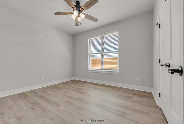 spare room featuring light hardwood / wood-style flooring and ceiling fan