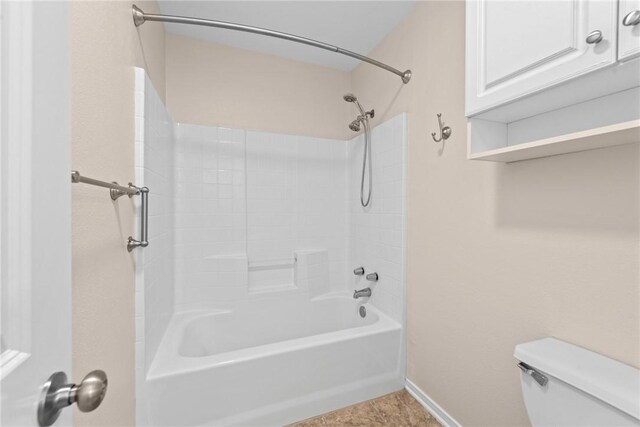 5115 Bellerive Bend Dr, College Station, TX 77845 - bathroom featuring toilet, shower / bathtub combination, and baseboards